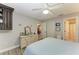 Bedroom with a dresser, built-in shelving and ceiling fan at 718 N Jefferson Ave # 718, Sarasota, FL 34237