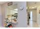 View of a kitchen with white cabinets, stainless steel appliances, and a breakfast bar at 718 N Jefferson Ave # 718, Sarasota, FL 34237