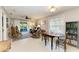 Living room with rocking chairs, tiled floors, and access to patio at 718 N Jefferson Ave # 718, Sarasota, FL 34237