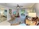 Open living room with view of bedroom and patio at 718 N Jefferson Ave # 718, Sarasota, FL 34237