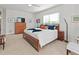 Serene bedroom with a king-size bed and dresser at 7610 34Th W Ave # 203, Bradenton, FL 34209