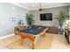 Game room with pool table and large TV at 7610 34Th W Ave # 203, Bradenton, FL 34209