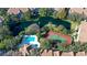 Community pool, tennis courts, and pond at 850 S Tamiami Trl # 731, Sarasota, FL 34236