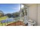 White wicker furniture on a screened balcony at 850 S Tamiami Trl # 731, Sarasota, FL 34236