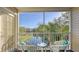 Screened balcony overlooking a tranquil pond at 850 S Tamiami Trl # 731, Sarasota, FL 34236