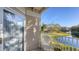 White wicker chair on balcony with pond view at 850 S Tamiami Trl # 731, Sarasota, FL 34236