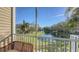 Screened balcony overlooking a pond and trees at 850 S Tamiami Trl # 731, Sarasota, FL 34236