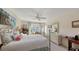 Bright bedroom with a queen-size bed, dresser, and access to a private balcony at 850 S Tamiami Trl # 731, Sarasota, FL 34236