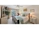 Spacious bedroom with a full-size bed and private balcony access at 850 S Tamiami Trl # 731, Sarasota, FL 34236