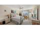 Bright bedroom with a queen bed and large windows at 850 S Tamiami Trl # 731, Sarasota, FL 34236