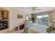 Bedroom with a full-size bed, dresser, and balcony overlooking the water at 850 S Tamiami Trl # 731, Sarasota, FL 34236