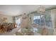 Bright dining area with glass table and wicker chairs at 850 S Tamiami Trl # 731, Sarasota, FL 34236