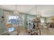 Dining area with glass table, wicker chairs, and view at 850 S Tamiami Trl # 731, Sarasota, FL 34236
