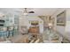 Spacious living room with a sofa, chair, and access to kitchen at 850 S Tamiami Trl # 731, Sarasota, FL 34236