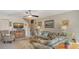 Cozy living room featuring a comfortable sofa and large TV at 850 S Tamiami Trl # 731, Sarasota, FL 34236