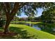 Peaceful pond with fountain and lush green landscaping at 850 S Tamiami Trl # 731, Sarasota, FL 34236