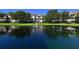 Serene pond with fountain in the center, reflecting buildings and trees at 850 S Tamiami Trl # 731, Sarasota, FL 34236