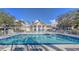 Refreshing community pool with surrounding lounge chairs at 850 S Tamiami Trl # 731, Sarasota, FL 34236