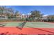 Community tennis court with red and green surface at 850 S Tamiami Trl # 731, Sarasota, FL 34236