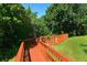 Wooden walkway leading to a waterfront with green landscape at 850 S Tamiami Trl # 731, Sarasota, FL 34236