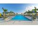 Expansive community pool with cabanas and lounge chairs at 899 Seascape Pl, Sarasota, FL 34240