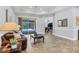 Living area with leather furniture and sliding glass doors leading to the pool at 112 170Th E St, Bradenton, FL 34212