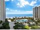 Oceanfront community with resort-style pool and lush landscaping at 1211 Gulf Of Mexico Dr # 401, Longboat Key, FL 34228