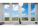 Expansive kitchen window framing breathtaking coastal scenery and blue skies at 1211 Gulf Of Mexico Dr # 401, Longboat Key, FL 34228