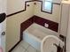 Bathroom with a tub, sink, and vintage-style tile at 1605 32Nd W St, Bradenton, FL 34205