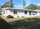 Single story home with a screened porch and fenced backyard at 1605 32Nd W St, Bradenton, FL 34205