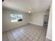 Living room with tile floors and a view to the front yard at 1605 32Nd W St, Bradenton, FL 34205