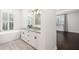 Elegant bathroom with double vanity, soaking tub, and walk-in shower at 224 Corelli Dr, Nokomis, FL 34275