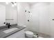 Clean bathroom with a walk-in shower and gray tile at 224 Corelli Dr, Nokomis, FL 34275