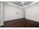 Bright bedroom with dark hardwood floors and ceiling fan at 224 Corelli Dr, Nokomis, FL 34275