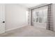 Spacious bedroom with neutral carpeting and large window at 224 Corelli Dr, Nokomis, FL 34275