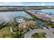 Community clubhouse with pool, tennis, and lake views at 224 Corelli Dr, Nokomis, FL 34275