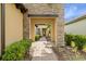 Elegant entryway with a stone walkway leading to a charming front door at 224 Corelli Dr, Nokomis, FL 34275