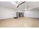Garage with built-in storage cabinets and epoxy floor at 224 Corelli Dr, Nokomis, FL 34275