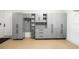 Organized garage featuring gray storage cabinets at 224 Corelli Dr, Nokomis, FL 34275