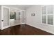 Bright home office with dark hardwood floors and view of backyard pool at 224 Corelli Dr, Nokomis, FL 34275