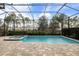 Inviting pool area with spa and screened enclosure at 224 Corelli Dr, Nokomis, FL 34275