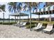 Relaxing poolside cabanas with lounge chairs at 224 Corelli Dr, Nokomis, FL 34275