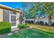 Private fenced backyard with lush landscaping and a screened-in patio at 2520 Terracina Dr, Venice, FL 34292