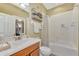 Guest bathroom with single vanity, bathtub/shower combo, and decorative shower curtain at 2520 Terracina Dr, Venice, FL 34292