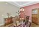 Dining room with wood table, chairs, and decorative wall hangings at 2520 Terracina Dr, Venice, FL 34292