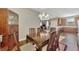 Dining area with wood furniture, a china cabinet, and open sightlines to the kitchen at 2520 Terracina Dr, Venice, FL 34292