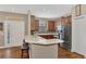 The kitchen is equipped with stainless steel appliances and wood cabinetry at 2520 Terracina Dr, Venice, FL 34292
