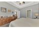 Large main bedroom with plush carpeting, ceiling fan, and walk-in closet at 2520 Terracina Dr, Venice, FL 34292