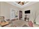 Second view of the office with additional seating, entertainment center, and hallway access at 2520 Terracina Dr, Venice, FL 34292