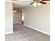 Spacious living room with plush carpeting, ceiling fan, and neutral paint at 2766 Heather Pl, Sarasota, FL 34235